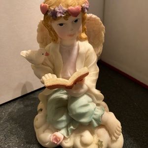 Sitting Angel with book Angel lovers she’s pretty
